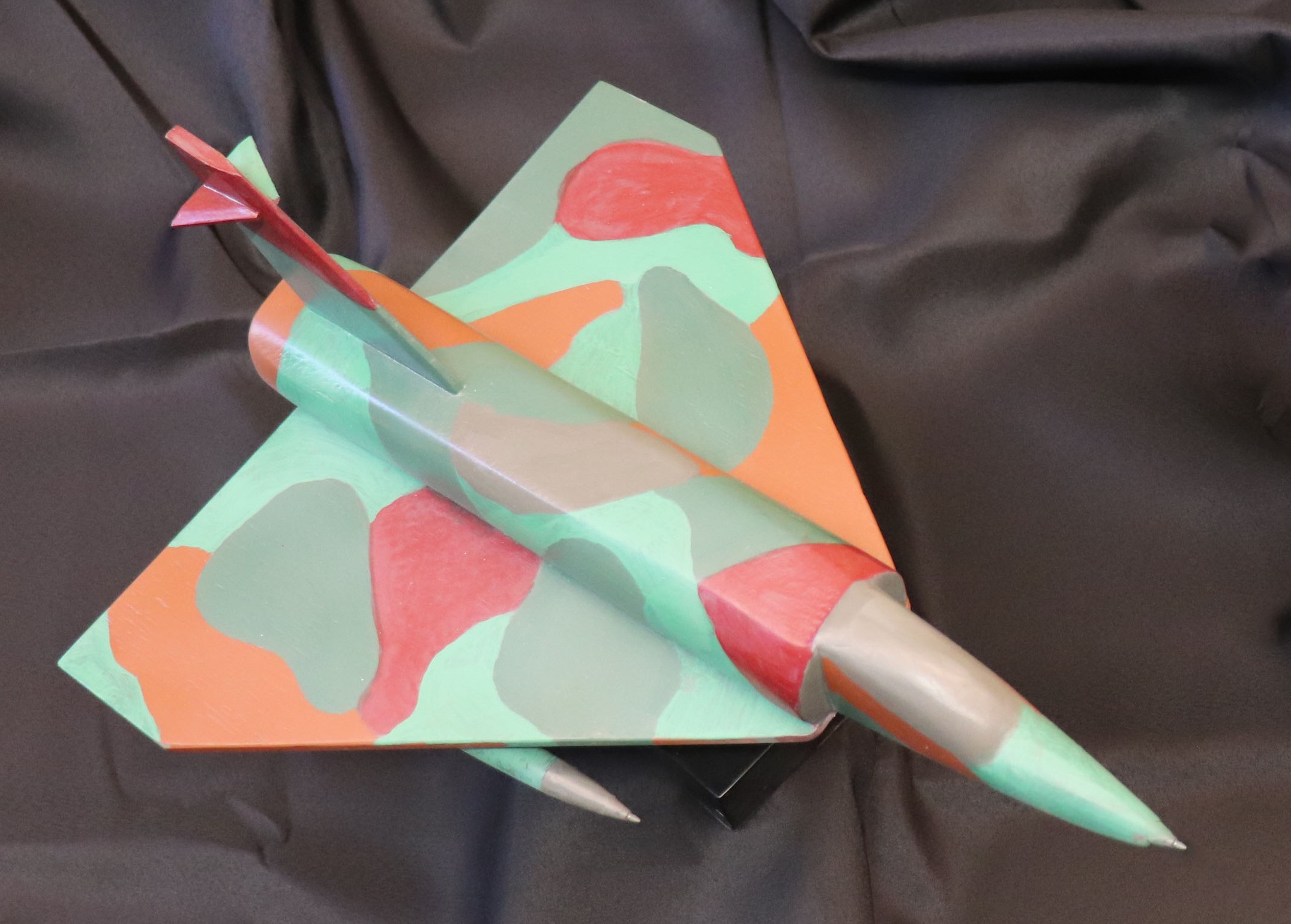 Priceless Wooden F-15 model plane handcrafted by author and artist Cesar Chavez, specially for Puro Empower 2023