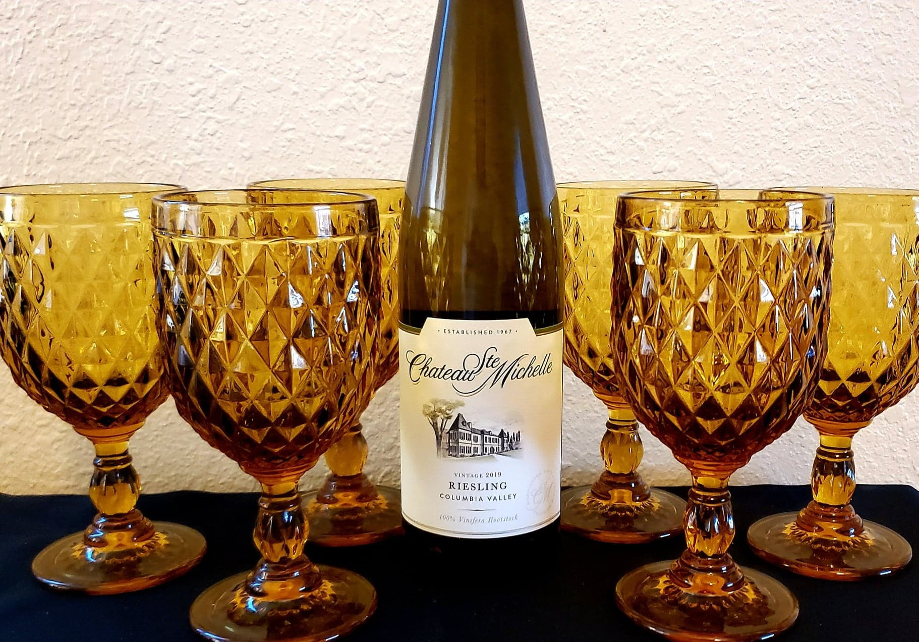 6 vintage inspired Pier-1 Imports wine glasses in deep yellow with 1 bottle of Riesling Columbia Valley 2019.