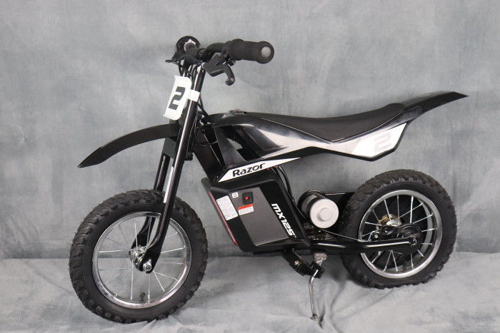 A miniature, electric-powered entry-level dirt bike designed for young riders ages 5 to 7 and up.