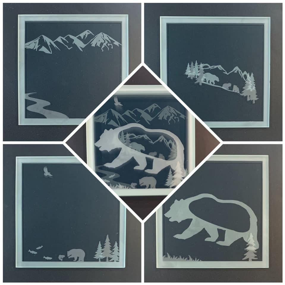 Set of four custom designed Etched glass animal coasters by Julie Kent. Each individual coaster is uniquely etchedon both sides, creating a 3D layered design when the four coasters are stacked. Coasters are 3 1/2" in diameter.