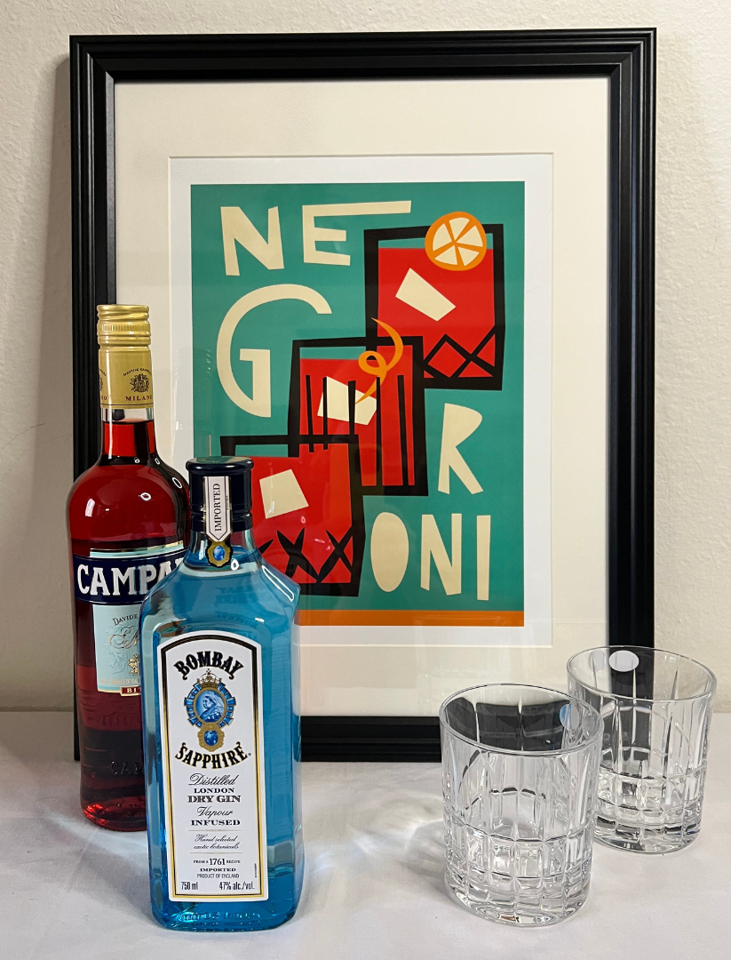 Negroni pack: framed Negroni themed artwork, rocks glasses, bottle of Campari & bottle of gin