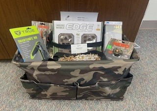 flashlight, head light, smart knife, game camera, radio, camo bag