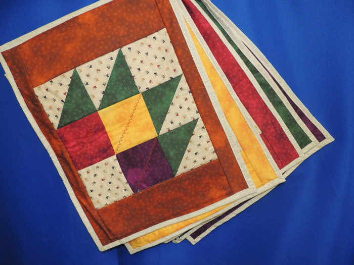 A set of 5, beautiful handmade, quilted placemats.