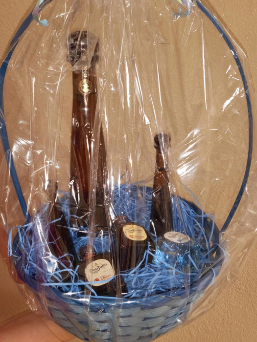 3 individual shots of Don Julio 1942 Tequila, along with 2 smaller bottles and a large bottle. This entire package is valued at round $250 or more.
