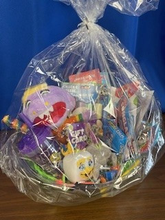 Chuck E. Cheese gift card, Stuffed toy, chalk, guest pass for pizza and drinks, candy, kids cup