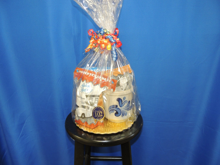 A cute Slaton Bakery container, with 3 bags of cookies.