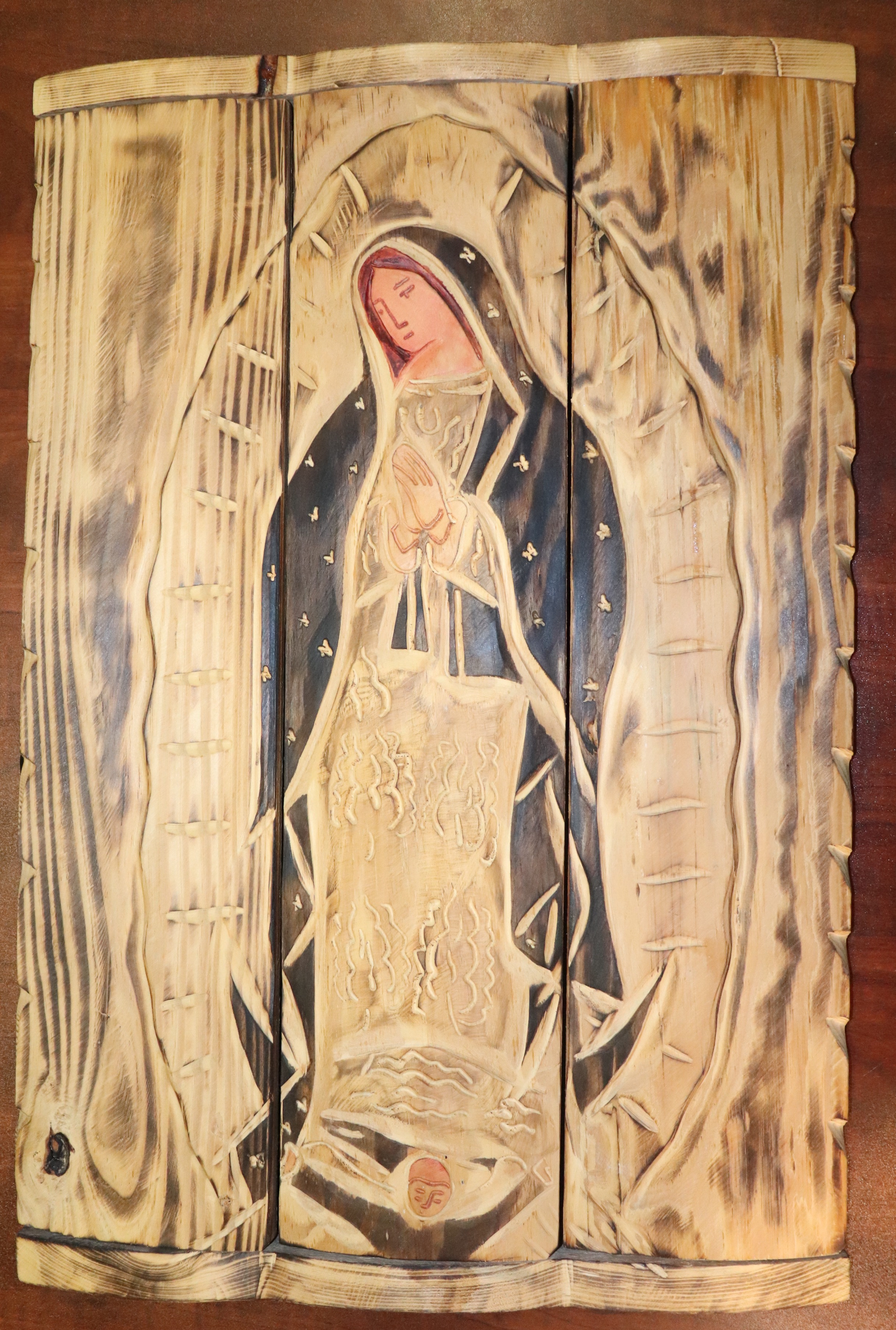 Pyrographed and painted 'Virgen de Guadalupe' on wood 15 x 25