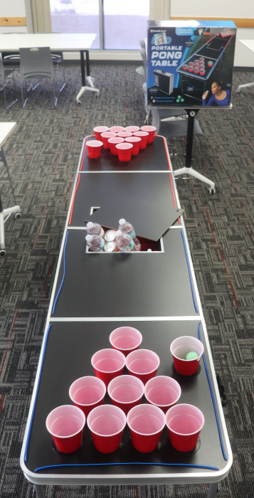 Upgrade your party anywhere with this portable, foldable pong table featuring a built-in cooler bag, cup holders, and vibrant LED lights for day or night play.