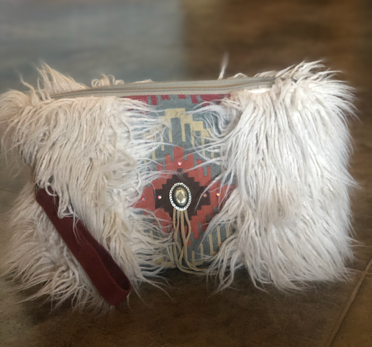 Handmade southwestern faux fur clutch.  Minor interior staining.