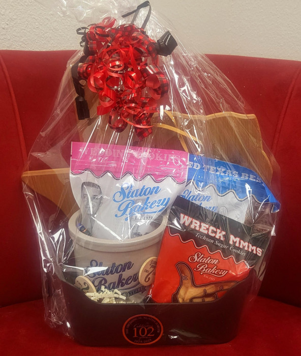 This basket includes 2 tokens for free donuts, some yummy bags of wedding cookies, sugar cookies and vanilla wafers, along with a gorgeous container