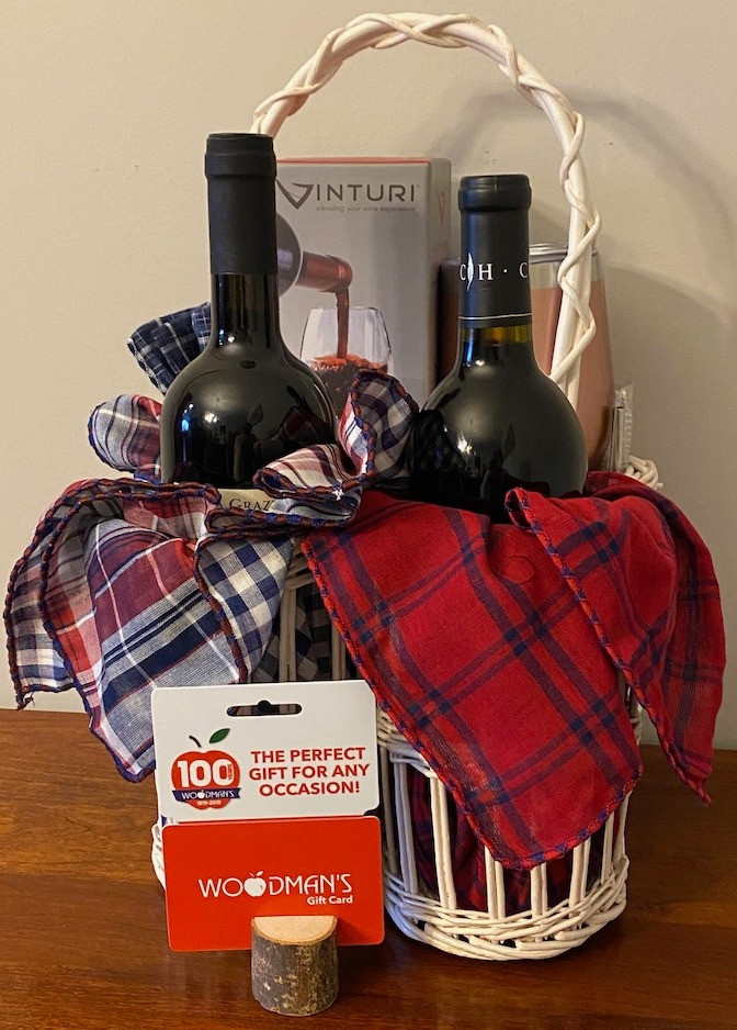 2 bottles of red wine with an aerator, plus a $50 gift card for Woodman's, and 2 wine tumblers.