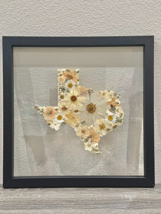 Beautiful REAL pressed flowers in the shape of the Lonestar State, in a beautiful black/grey wooden frame.
