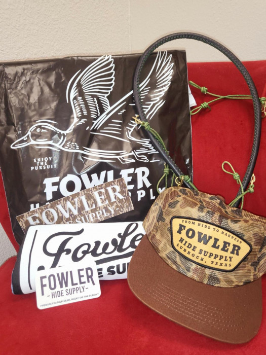 A cool hat, Size M shirt and a full rope call lanyard for holding your duck calls (ALL LEATHER, a $175 value in itself).