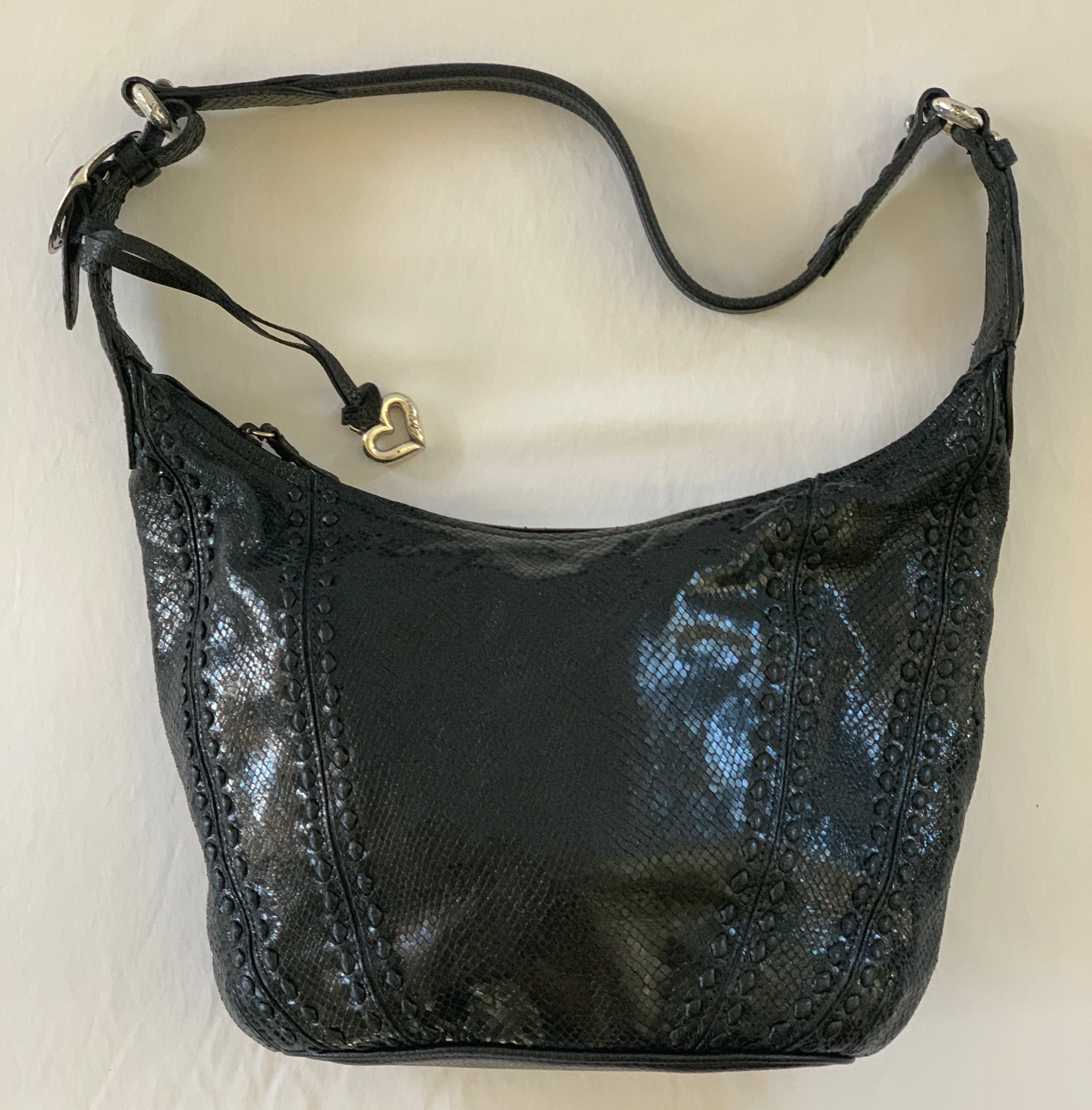 Black soft leather snake skin shoulder bag with multicolor striped interior. Great condition.