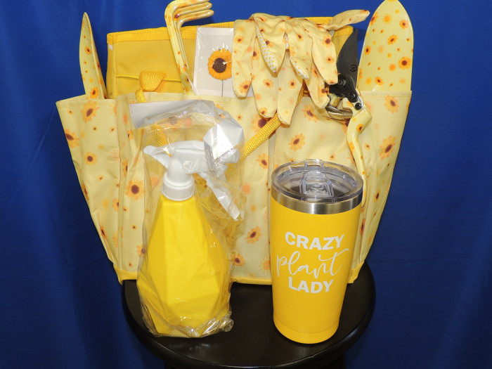 Adorable sunflower themed gardening back. This set includes 4 gardening tools, a spray bottle, pair of gloves, tumbler and carrying bag.