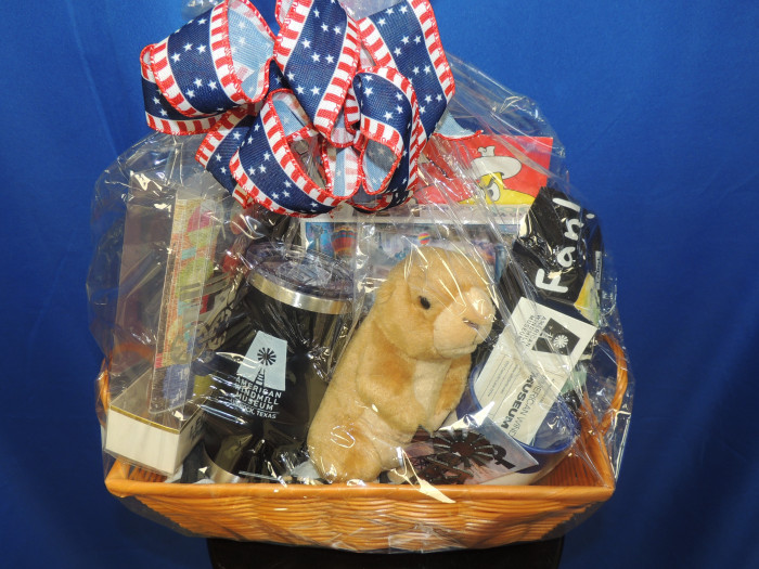 beautiful gift basket with a tumbler, tickets to the American Windmill Museum, a T shirt, stuffed groundhog and more assorted fun.