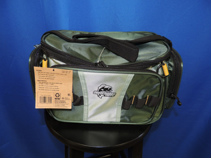 This tackle box holds FOUR boxes, is green in color.