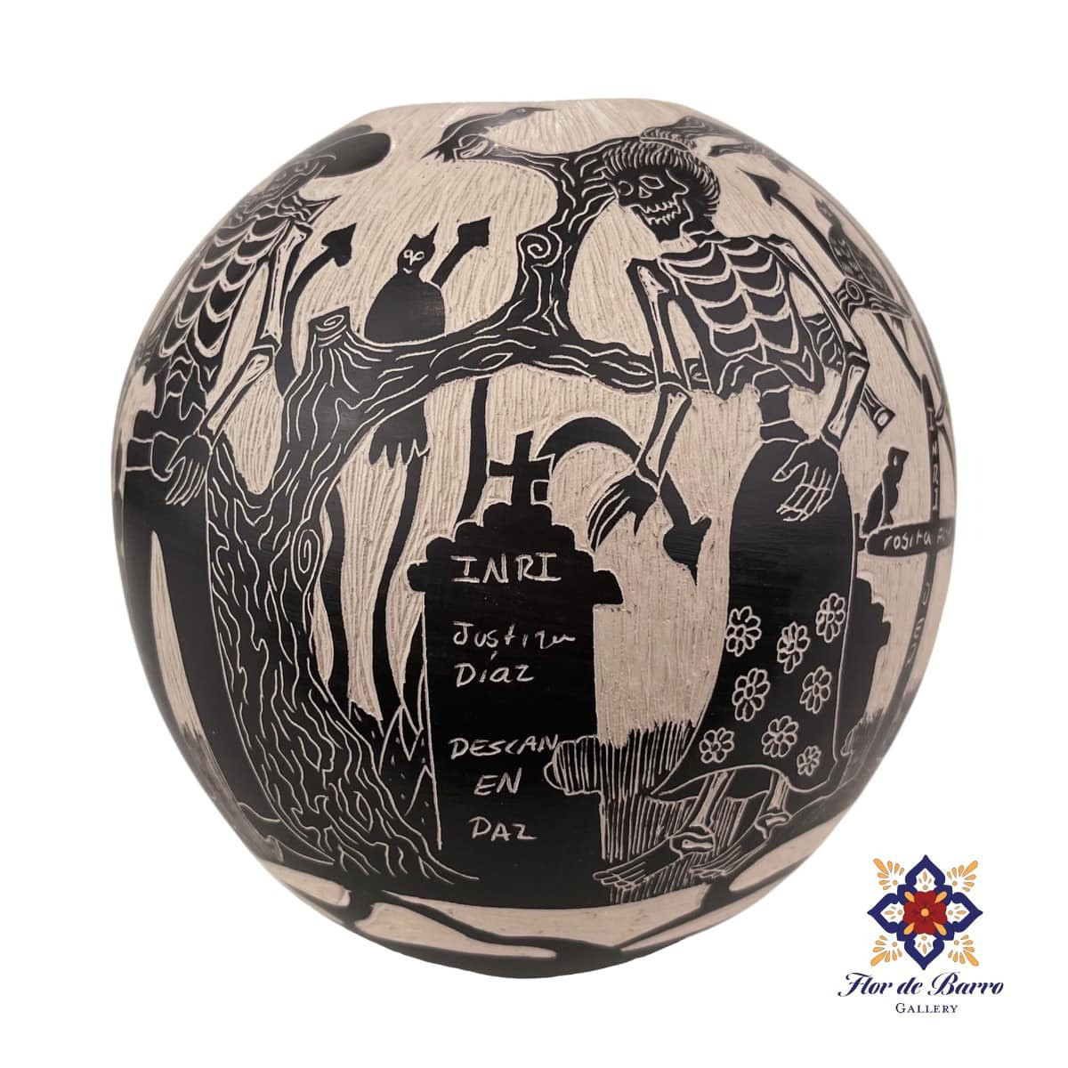 Handmade Mata Ortiz pottery by artist Diana Loya. Decorated using the sgraffito technique with a Day of the Dead cemetery scene.