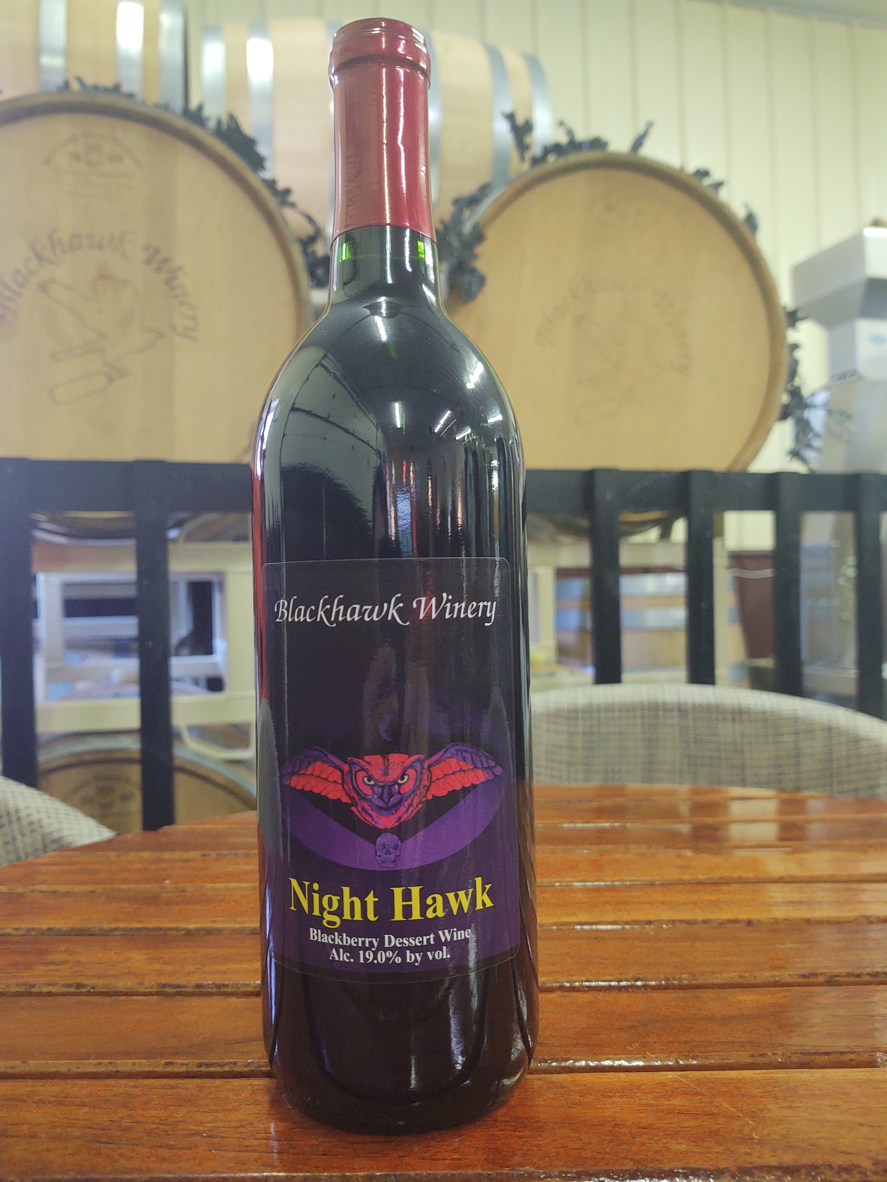 A bottle of Nighthawk Wine - A port style dessert wine made from blackberries. 750 ml bottle. Wine can only be shipped to the following states: AK, AZ, CO, DC, FL, GA, HI, IA, ID, IL, IN, KS, LA, MA, MD, ME, MN, MO, NC, ND, NE, NH, NM, NV, NY, OH, OR, PA, SC, TN, TX, VA, VT, WA, WI, WV, WY