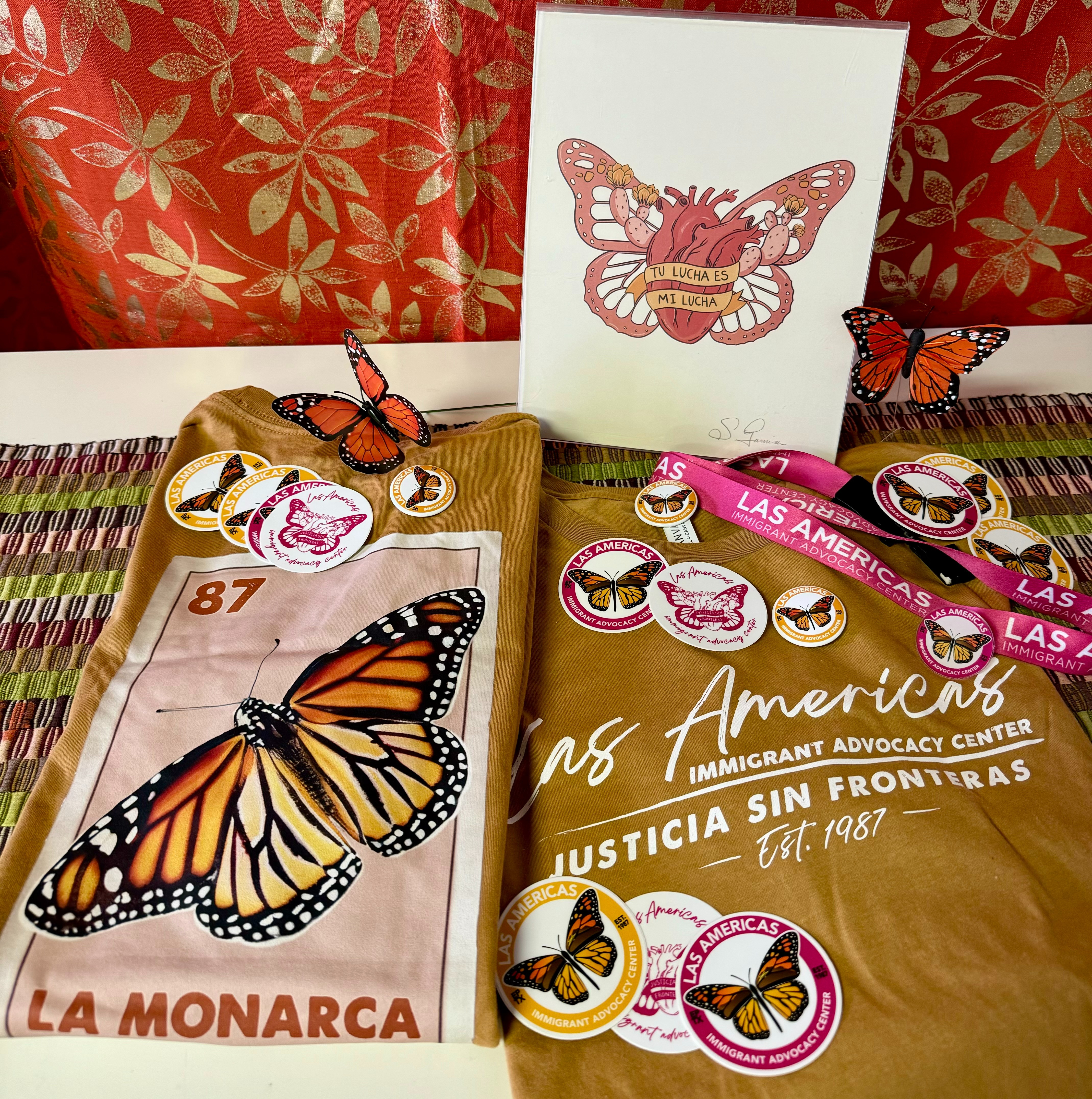 (2) Las Americas "La Monarca" tees, Justicia Sin Fronteras print, lanyard, stickers and pins