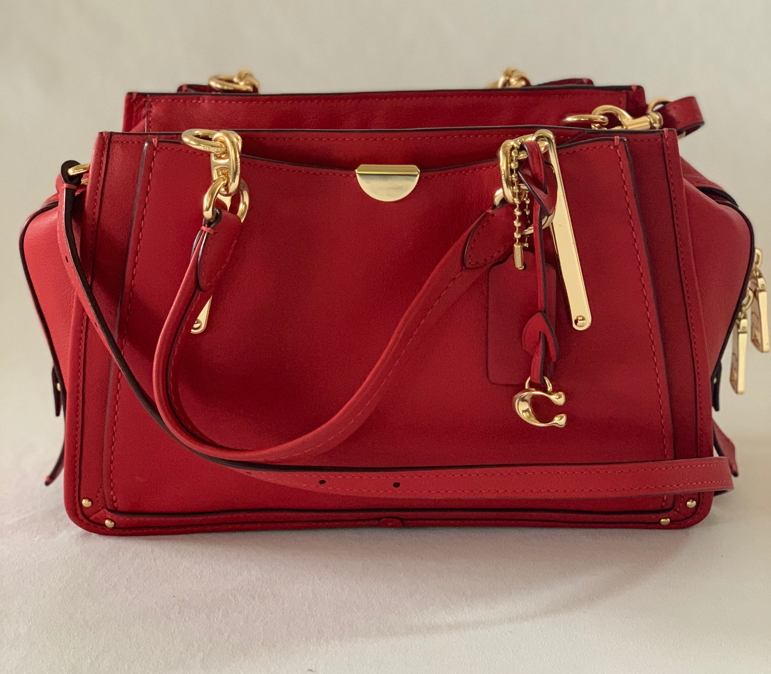 Red leather crossbody bag. Detachable strap. Gold accents. Blackberry suede/canvas interiors. Like new.