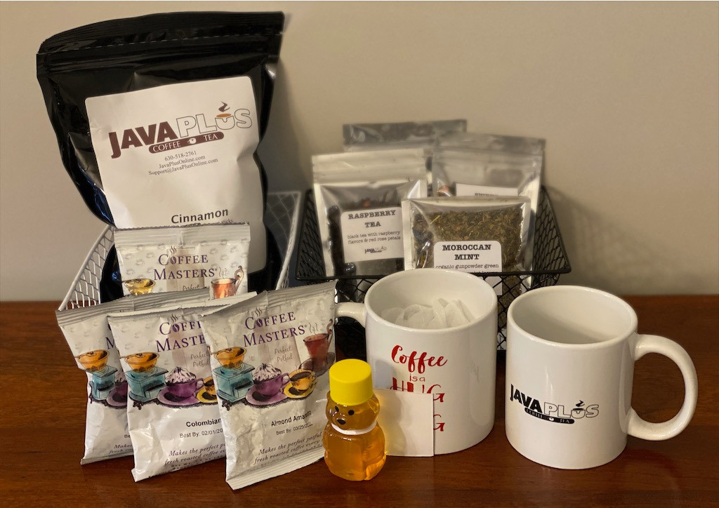 Caffeine lovers basket is filled with 1 lb. whole coffee beans, assorted ground coffees, 4-3oz. packages loose tea leaves and honey, and 2 coffee mugs.