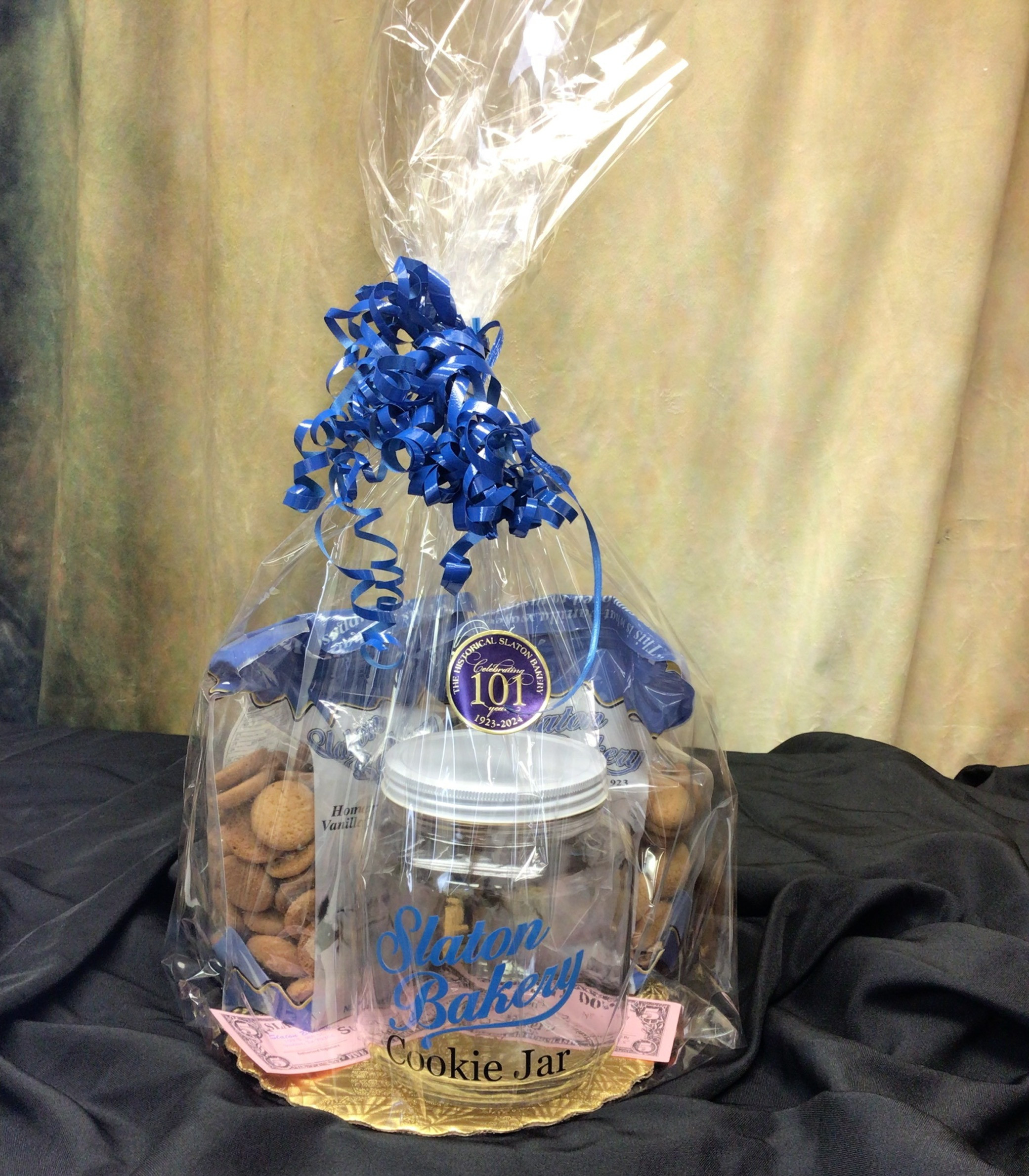 Cookie jar, 2 bags of Homemade Vanilla Wafers, and 2 $10 gift certificates.