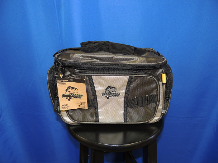 This tackle box holds FOUR boxes and is grey w/ tan in color.