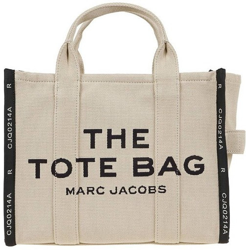 Crafted in luxe woven jacquard, this everyday tote features a top zip closure, top handles, and a removable adjustable crossbody strap. Interior includes multiple slip and zip pockets plus a card slot for easy organization—perfect for elevated, on-the-go style.