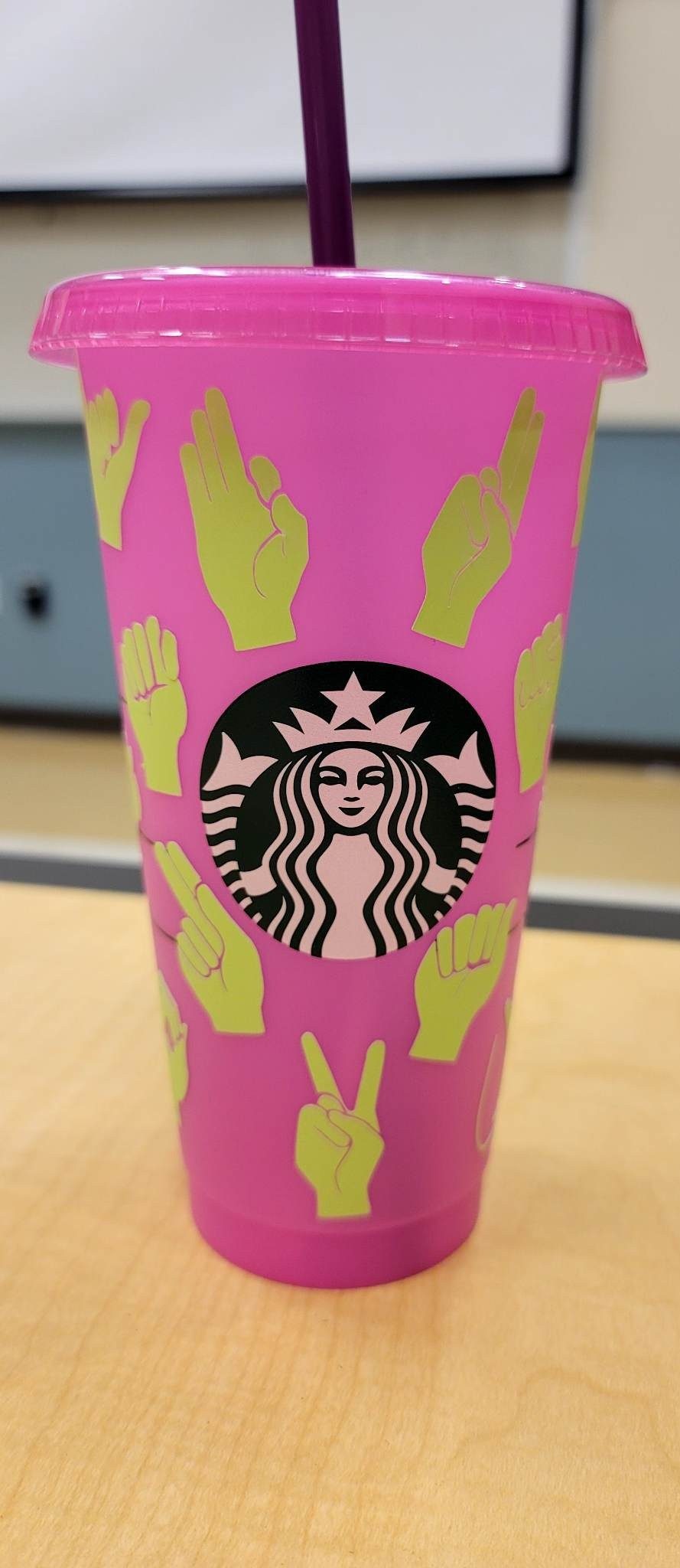 ASL-Adorned Starbucks Cup with Lid & Straw, 16oz. Pink plastic with lime green ASL Alphabet handshapes. By Hilda Calas-Pituk: Instagram @hiha_madetoorder | hepituk@icloud.com | View more images of this item at: https://drive.google.com/drive/folders/108pUyxmk-HX5uAuuCCuswEiTEZIp3n6s?usp=share_link