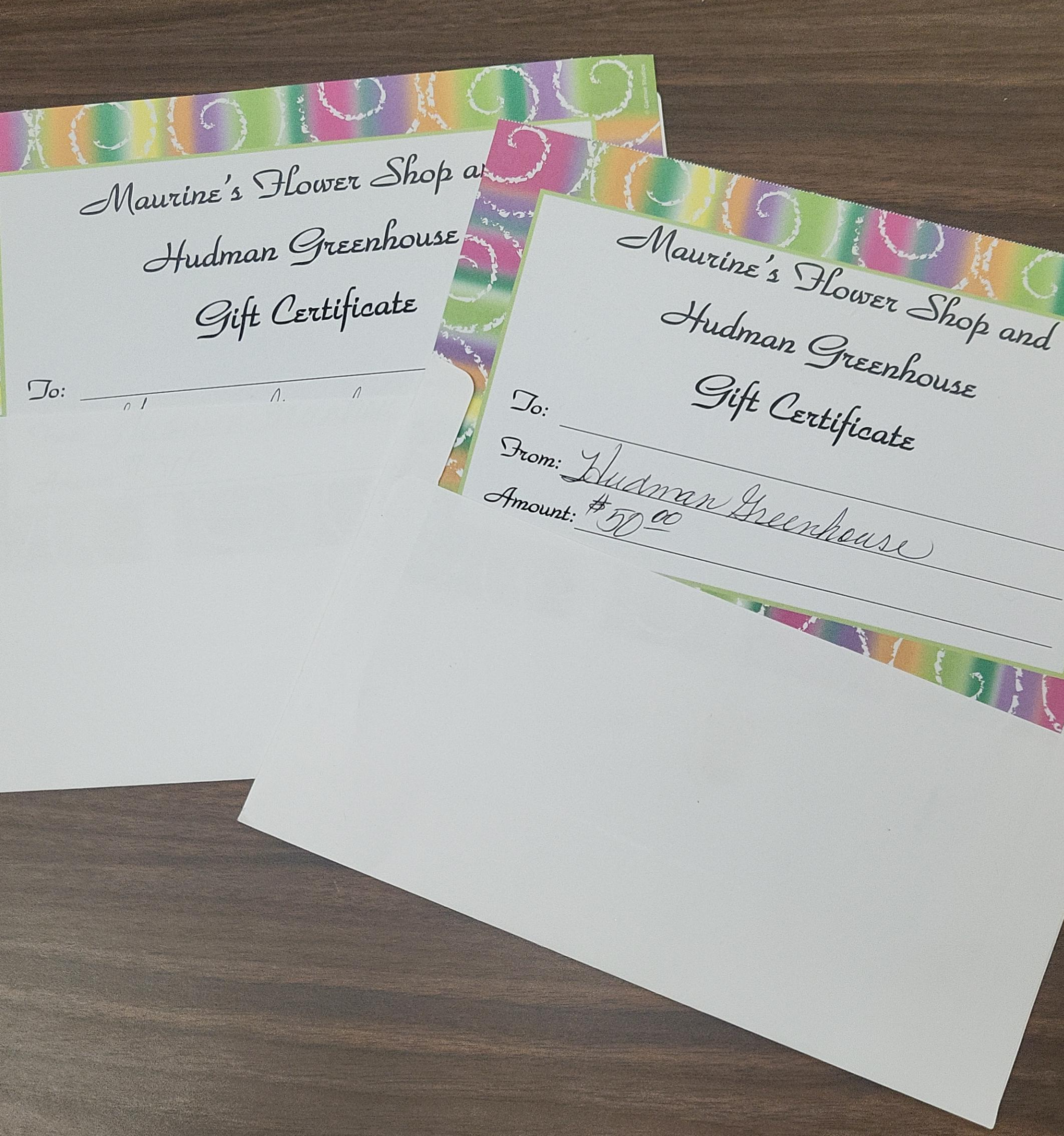 2, $50 gift certificates to Maurines Flower Shop OR Hudman Greenhouse