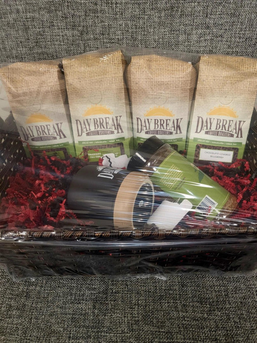 4 packs of Daybreak coffee, coffee rub and a mug.