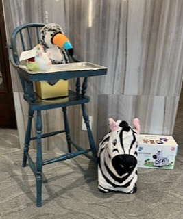 Vintage High Chair with attached lifting tray, Humpty Dumpty piggy bank stuffed toucan and bouncy zebra