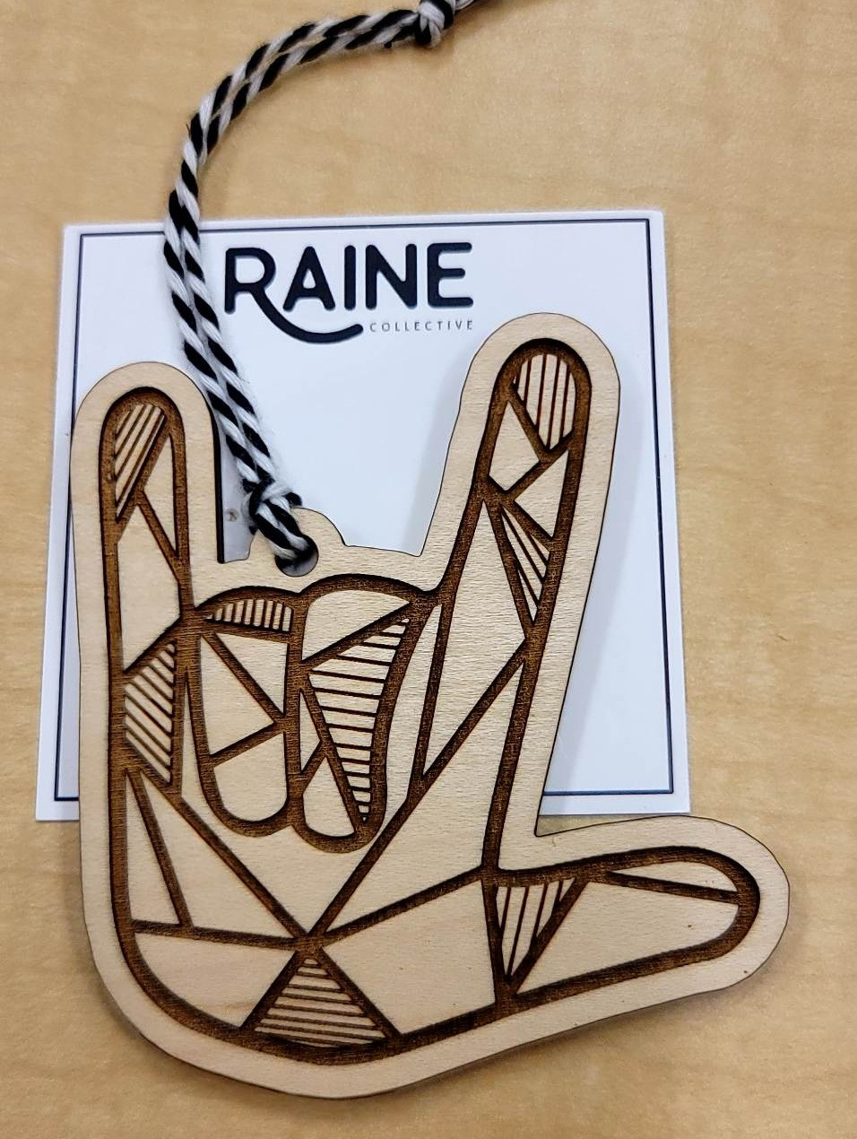 Laser-cut top-quality pre-finished maple wood I-Love-You (ILY) ornament/gift tag in Orange. Size 3in x 3in.  Donated by Raine Collective - A collective of Deaf female makers specializing in handmade accessories and gifts.