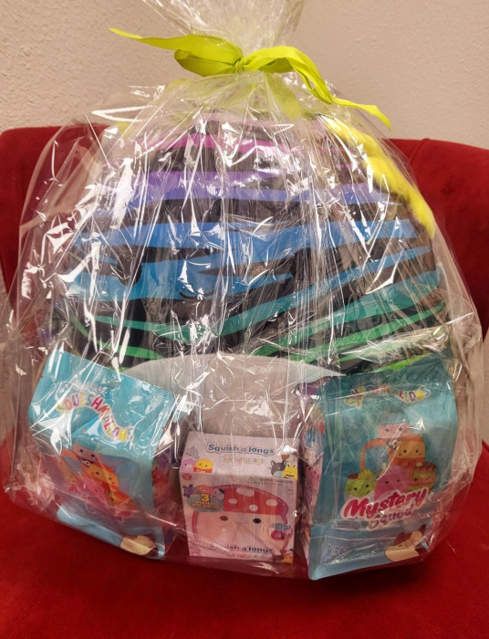 This item includes a zebra printed Axolotl Squishmallow, along with 2 Mystery Squads and some Squishmallow Tag a longs.