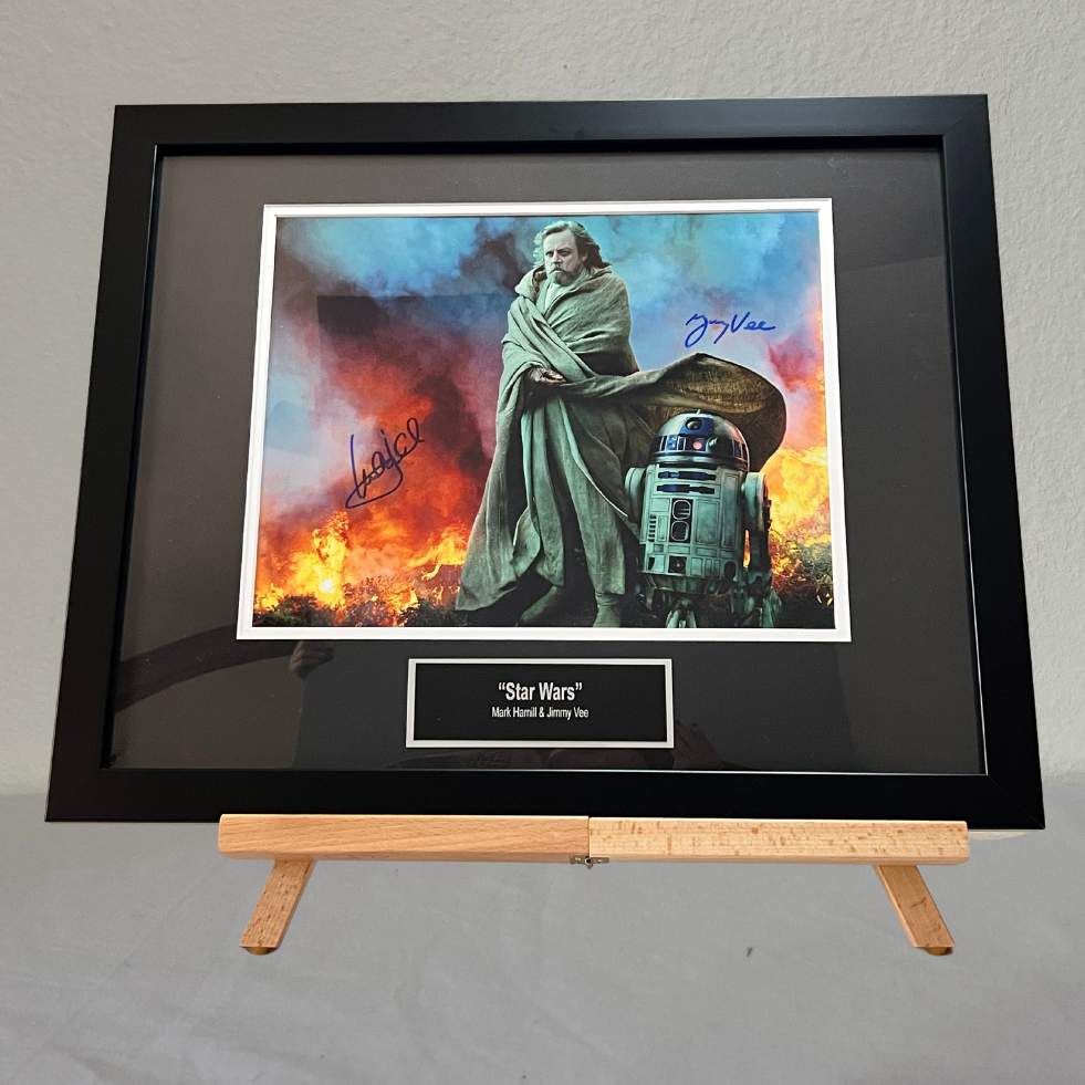 Signed photograph of Luke Skywalker and R2D2; signed by Mark Hammil (Luke Skywalker) and Jimmy Vee (R2D2)