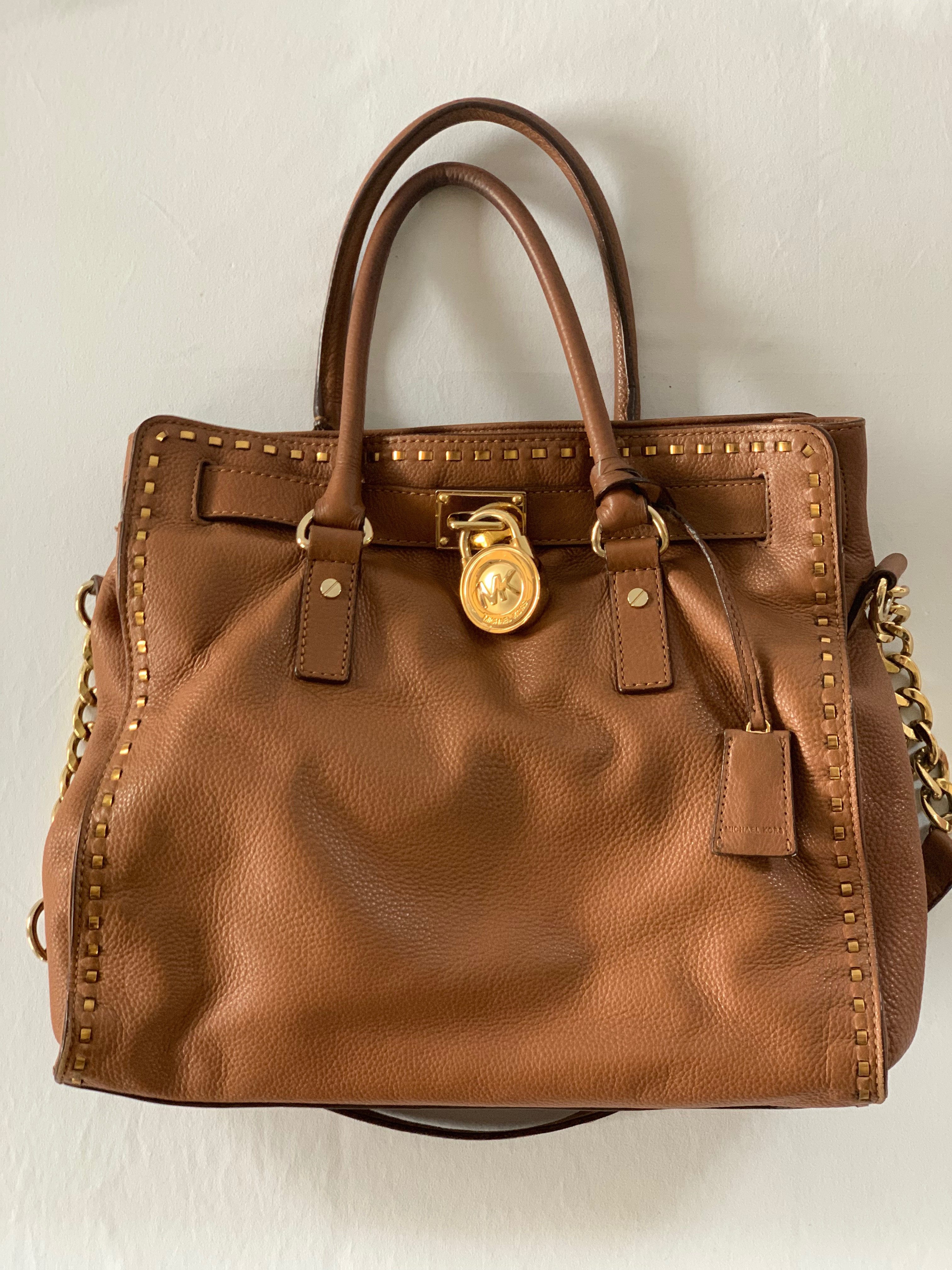 Brown leather tote with shoulder strap. Great condition.