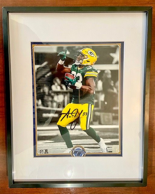 Aaron Jones is a hometown hero who played for the UTEP Miners and is now a running back for the Green Bay Packers. Aaron debuted at number 33 on the NFL Network's Top 100 Players of 2020. 8 X 10 autogrphed photo of Aaron Jones. The photo is matted and framed.
