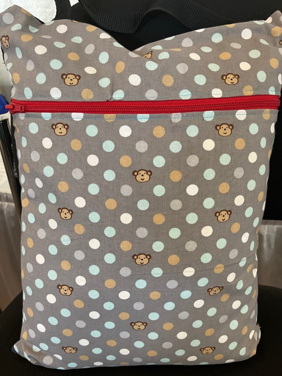 Monkey Print Pillow with zippered pouch. Approx. 14" x 10"