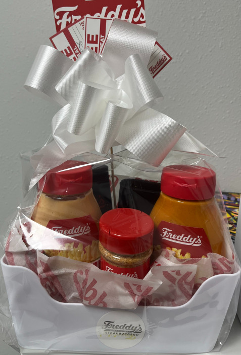 Enjoy a tasty bundle from Freddy’s featuring 2 sauces, seasoning, 2 custards, 4 gift cards, and 2 fun fidget toys—perfect for food lovers and a little extra fun!