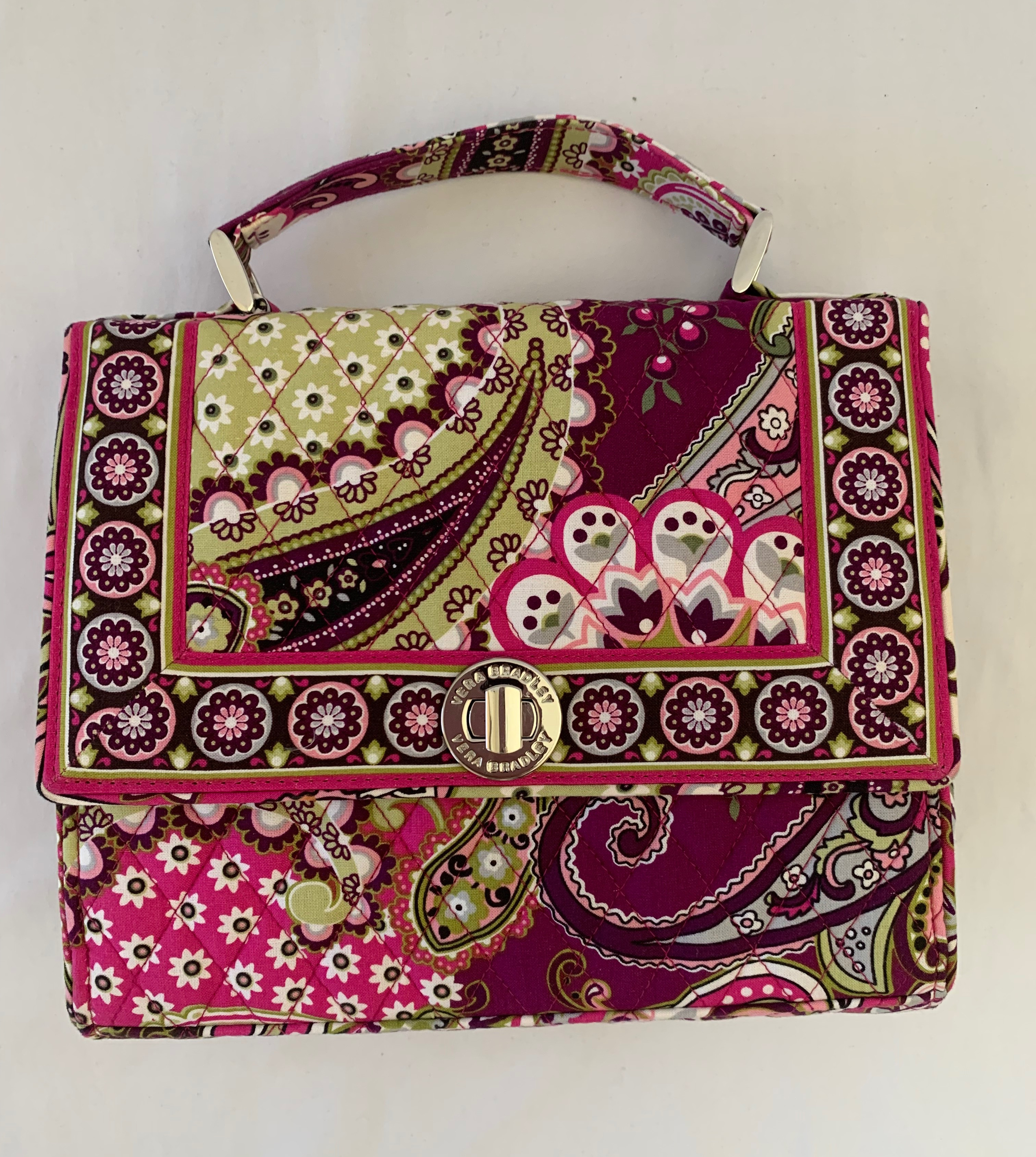 Quilted multicolored paisley clutch. Crossbody strap included. Brand new.