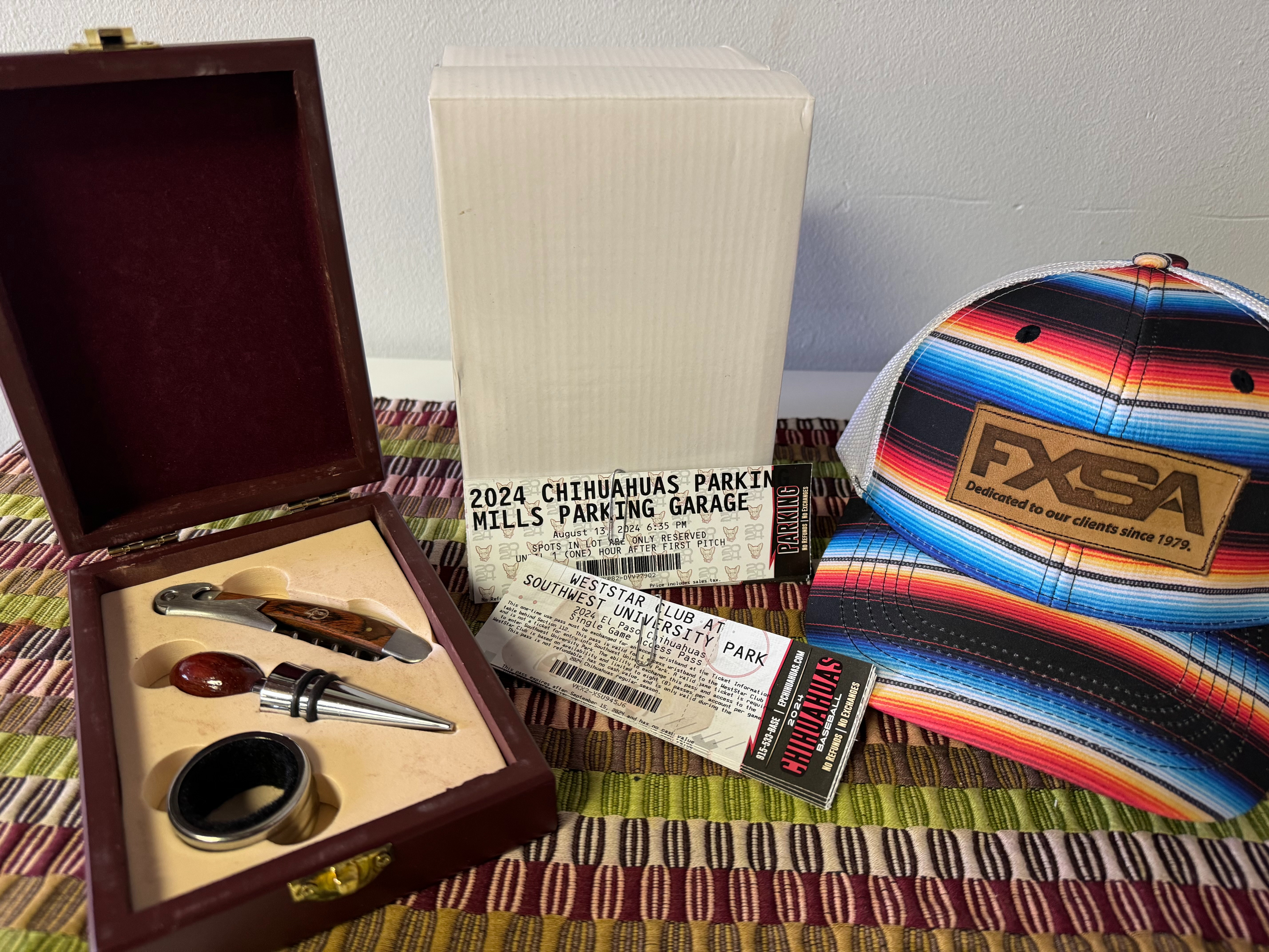 10 Chihuahuas Baseball Tickets, 1 Mills Parking ticket,  3 Wine bottle opener sets ,  3 FXSA caps
