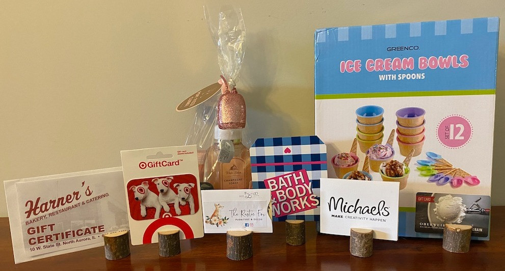Gift cards for 6 North Aurora merchants...Oberweis ($25), Harner's Bakery Restaurant ($50), Bath & Body Works ($25), Michael's ($25), Rustic Fox ($25) and Target ($25).  The  ice cream bowls and Bath & Body gift bag included.